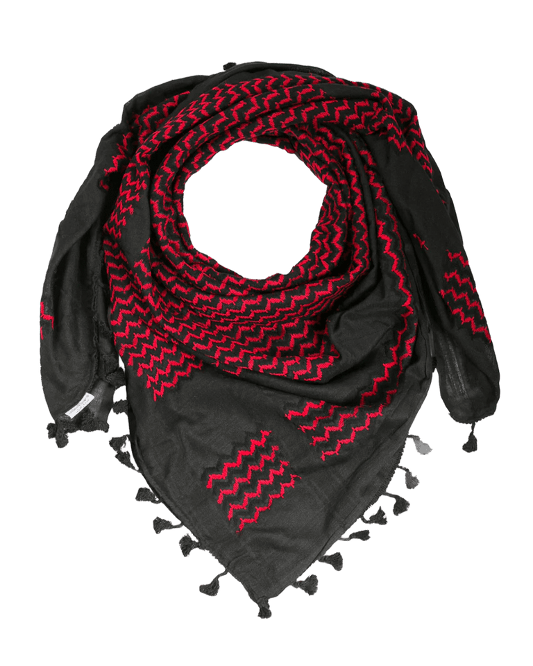 KUFIYA® Um Suleiman Kufiya, traditional black and white keffiyeh with intricate pattern, worn as cultural headwear.